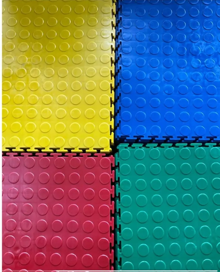 Interlocking coin-top tiles in yellow, blue, red and green